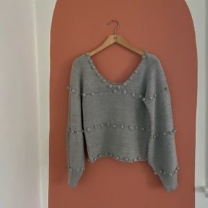 Grey sweater (missing two puff balls)